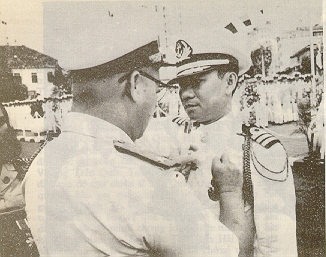 An officer is awarded a medal for his distinguished service
